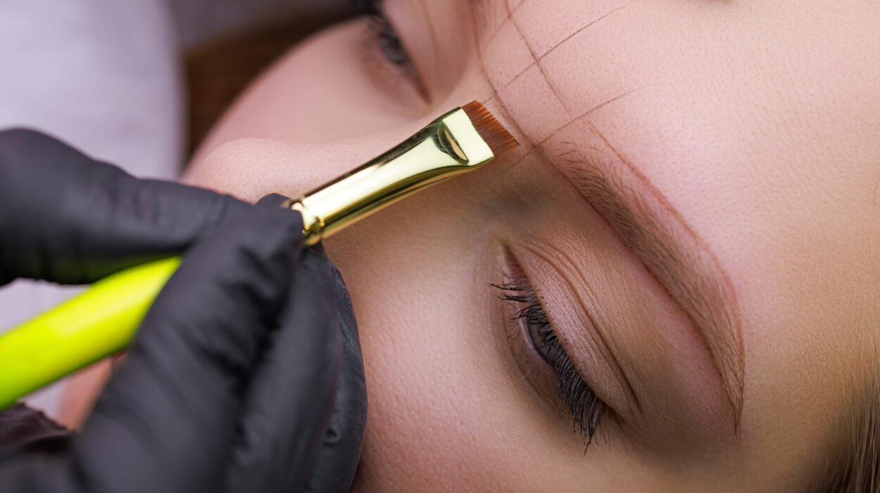 made sketch on the model's eyebrows before the permanent makeup procedure. PMU Procedure, Permanent Eyebrow Makeup.