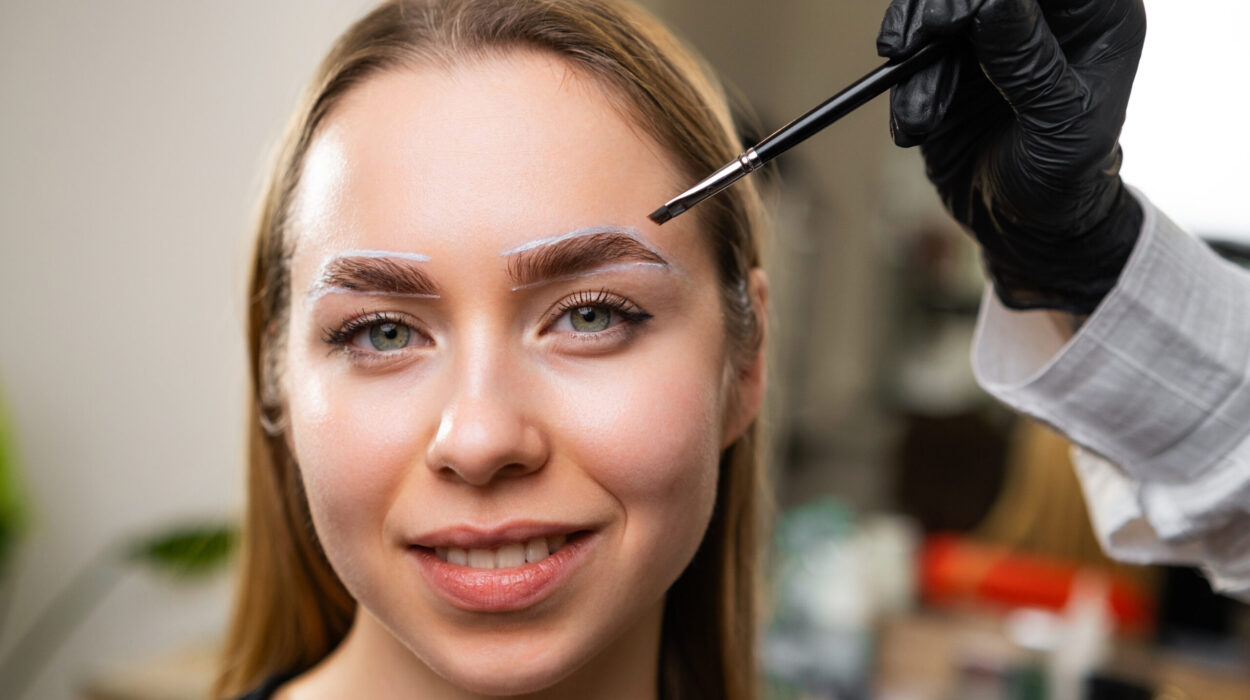 Portrait of a young woman during the procedure of dying brow.