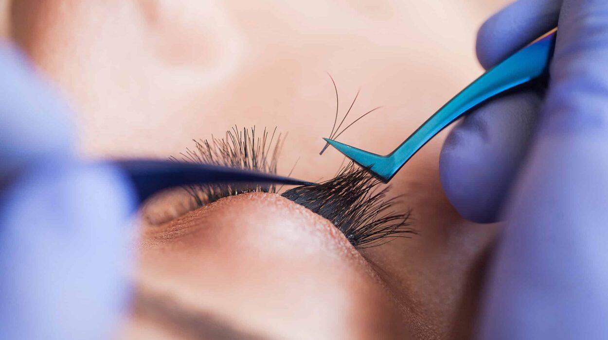 Eyelashes extensions. Fake Eyelashes. Eyelash Extension Procedure. Professional stylist lengthening female lashes. Master and a client in a beauty salon.